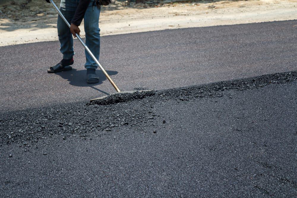 A Crest Property Care crew finishing a driveway sealing job in the Greater Toronto Area.